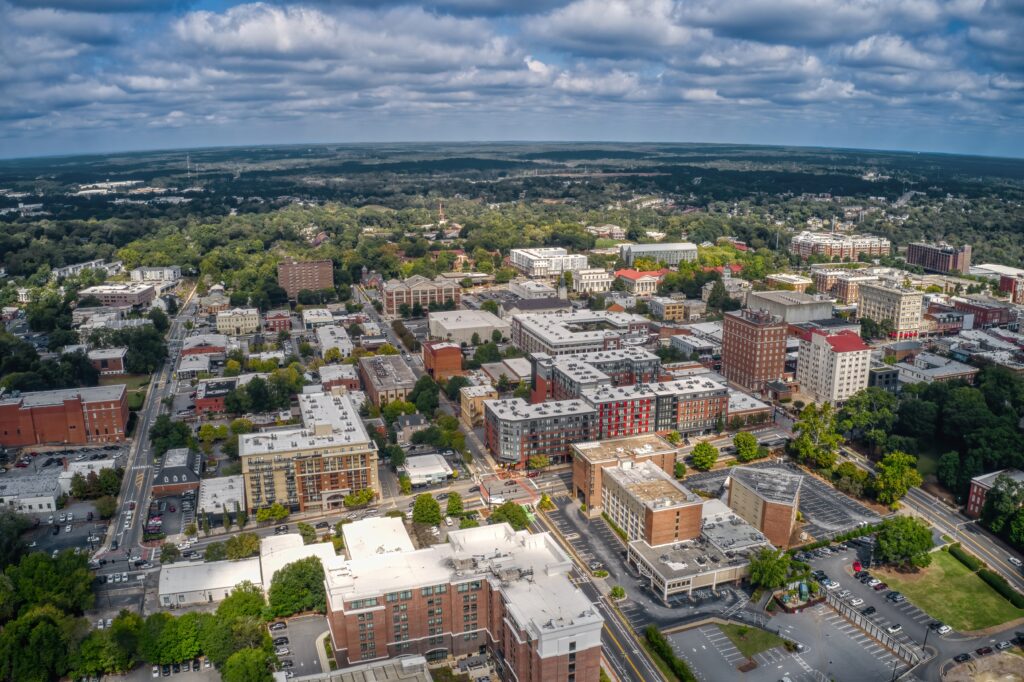 Free home valuation for residential properties in Athens featuring an aerial view of homes, neighborhoods, and the local real estate market.